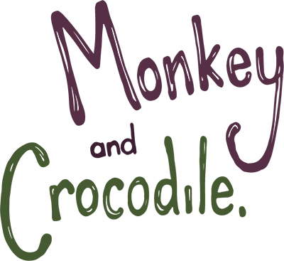 Monkey and Crocodile written in maroon and green lettering against a white background.
