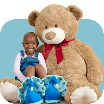 Little kid with big teddy bear