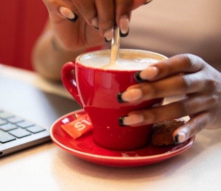 coffee in a cup being stirred